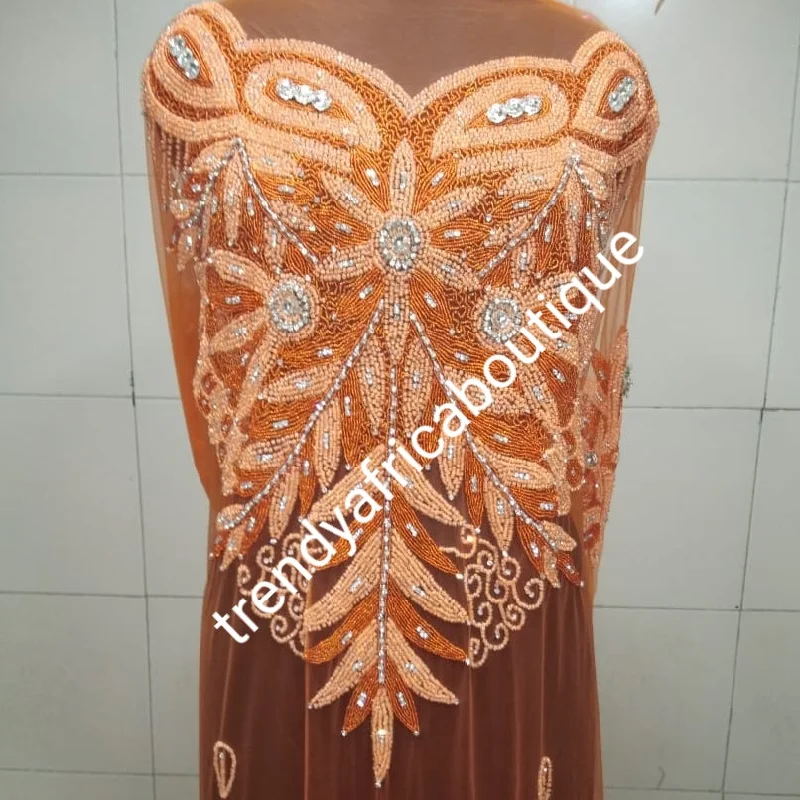 Orange color Heavily-beaded net for making blouses. Popularly use by Igbo/Delta/edo women for making modern big Occasion BlouseComes in 1.8yds lenght already design for your beautiful blouse Balloon Sleeve Blouse Orange color Heavily-beaded net for making blouses. Popularly use by Igbo/Delta/edo women for making modern big Occasion BlouseComes in 1.8yds lenght already design for your beautiful blouse Balloon Sleeve Blouse
